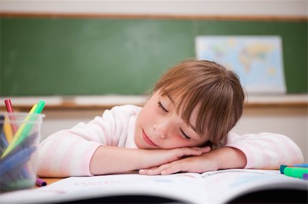 simsearch:400-06744675,k - Schoolgirl sleeping on a desk in a classroom Stock Photo - Budget Royalty-Free & Subscription, Code: 400-05895492