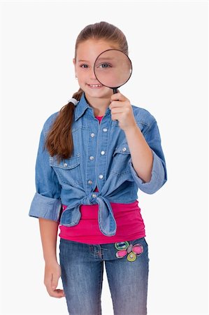 simsearch:400-04554899,k - Portrait of a girl looking through a magnifying glass against a white background Stock Photo - Budget Royalty-Free & Subscription, Code: 400-05895514