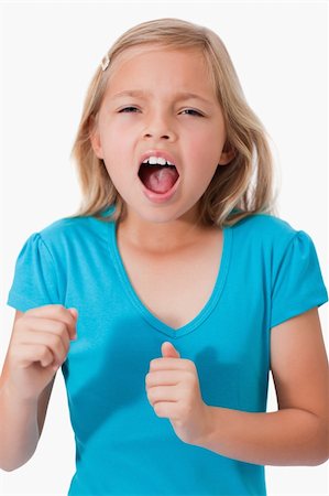 frustrated child white background - Portrait of a young girl screaming against a white background Stock Photo - Budget Royalty-Free & Subscription, Code: 400-05895567