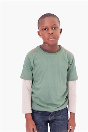 simsearch:6107-06117700,k - Portrait of boy posing against a white background Photographie de stock - Aubaine LD & Abonnement, Code: 400-05895627