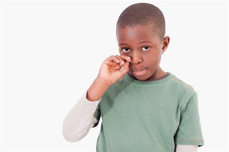 defeated boy - Cute boy crying against a white background Stock Photo - Budget Royalty-Free & Subscription, Code: 400-05895634