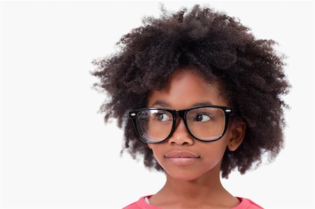 funny looking girls with glasses - Close up of a smart girl against a white background Stock Photo - Budget Royalty-Free & Subscription, Code: 400-05895692