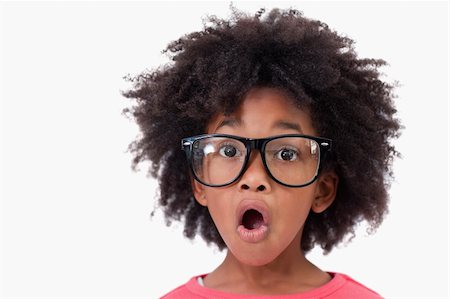 funny looking girls with glasses - Close up of a shocked smart girl against a white background Stock Photo - Budget Royalty-Free & Subscription, Code: 400-05895693