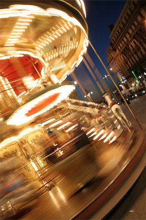 paris carousel - merry-go-round twisting fast in the night with thousands lights Stock Photo - Budget Royalty-Free & Subscription, Code: 400-05895826