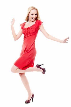 simsearch:400-06083238,k - Young lady in red dress dancing on white background Stock Photo - Budget Royalty-Free & Subscription, Code: 400-05895834