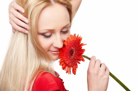 simsearch:400-09081321,k - Closeup portrait of female model holding red gerbera on white background Stock Photo - Budget Royalty-Free & Subscription, Code: 400-05895832