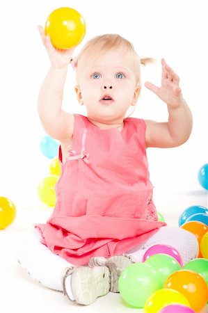 simsearch:400-04318989,k - Little baby girl playing with balls isolated on white Fotografie stock - Microstock e Abbonamento, Codice: 400-05895840