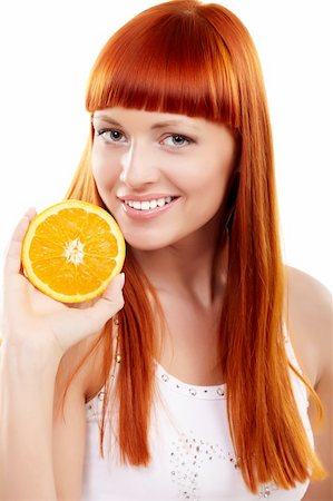 Young redhead woman with orange isolated on white Foto de stock - Super Valor sin royalties y Suscripción, Código: 400-05895842