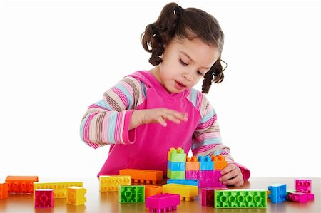plastic blocks - Stock image of little girl playing with construction blocks over white background Stock Photo - Budget Royalty-Free & Subscription, Code: 400-05895866