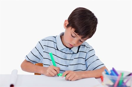 simsearch:400-05178086,k - Young boy drawing against a white background Photographie de stock - Aubaine LD & Abonnement, Code: 400-05896292