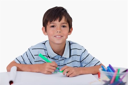 simsearch:400-05178086,k - Happy boy drawing against a white background Photographie de stock - Aubaine LD & Abonnement, Code: 400-05896293