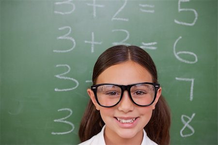 simsearch:400-05894745,k - Smart schoolgirl posing in front of a blackboard Stockbilder - Microstock & Abonnement, Bildnummer: 400-05896375