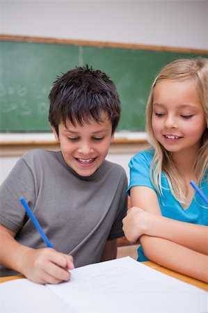 simsearch:400-05751679,k - Portrait of happy pupils working together in a classroom Stock Photo - Budget Royalty-Free & Subscription, Code: 400-05896526