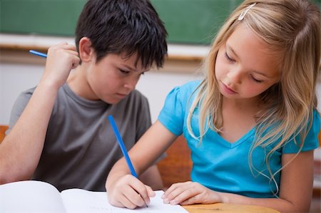 Focused pupils working together in a classroom Stock Photo - Budget Royalty-Free & Subscription, Code: 400-05896521