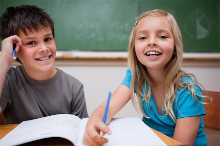 simsearch:400-05751679,k - Two children writing in a classroom Stock Photo - Budget Royalty-Free & Subscription, Code: 400-05896532