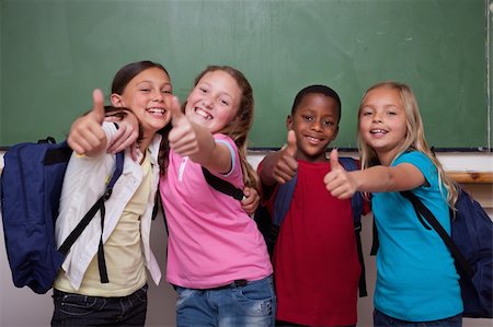 Classmates posing with the thumb up in a classroom Stock Photo - Budget Royalty-Free & Subscription, Code: 400-05896559