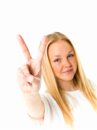 Young woman doing v-sign isolated on white background Photographie de stock - Aubaine LD & Abonnement, Code: 400-05896981