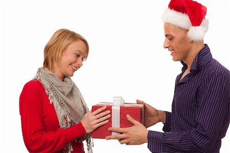 Christmas gift - Man giving a present to a girl Stock Photo - Budget Royalty-Free & Subscription, Code: 400-05897395