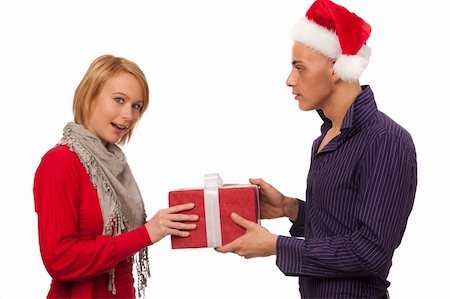 Christmas gift - Man giving a present to a girl Stock Photo - Budget Royalty-Free & Subscription, Code: 400-05897396