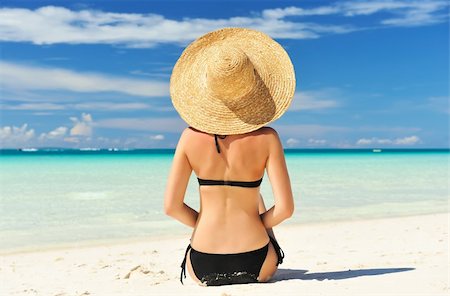 Girl on a tropical beach with hat Stock Photo - Budget Royalty-Free & Subscription, Code: 400-05897555