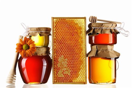 Jars of honey and dipper isolated over white Photographie de stock - Aubaine LD & Abonnement, Code: 400-05897598