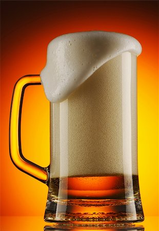 simsearch:400-04011173,k - Beer mug with froth pouring out Stock Photo - Budget Royalty-Free & Subscription, Code: 400-05897642