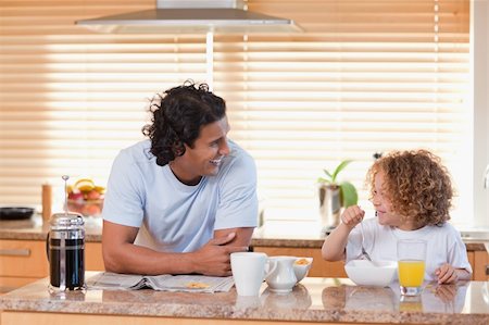 simsearch:400-04708507,k - Young father and daughter having breakfast in the kitchen Stock Photo - Budget Royalty-Free & Subscription, Code: 400-05897720
