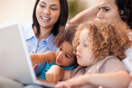 simsearch:400-05897773,k - Young family having a good time at the laptop together Stock Photo - Budget Royalty-Free & Subscription, Code: 400-05897777