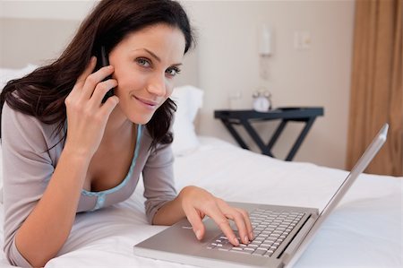 simsearch:400-05737165,k - Young woman on the phone surfing the internet Stock Photo - Budget Royalty-Free & Subscription, Code: 400-05897946