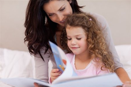 Young mother reading a book with her daughter Stock Photo - Budget Royalty-Free & Subscription, Code: 400-05898092