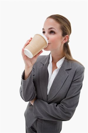 simsearch:400-04188263,k - Portrait of a businesswoman drinking a takeaway coffee against a white background Foto de stock - Super Valor sin royalties y Suscripción, Código: 400-05898179
