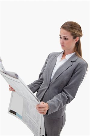 simsearch:400-07222698,k - Portrait of a surprised businesswoman reading the news against a white background Foto de stock - Royalty-Free Super Valor e Assinatura, Número: 400-05898185