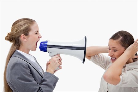 Manager yelling at her coworker through a megaphone against a white background Stock Photo - Budget Royalty-Free & Subscription, Code: 400-05898217