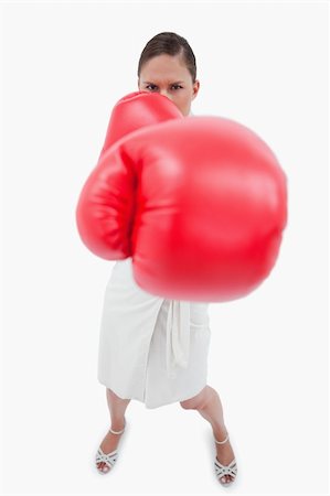 simsearch:400-05718453,k - Portrait of an angry boxing businesswoman against a white background Stock Photo - Budget Royalty-Free & Subscription, Code: 400-05898246