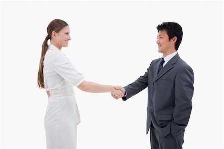 simsearch:400-04769433,k - Business people shaking hands against a white background Foto de stock - Super Valor sin royalties y Suscripción, Código: 400-05898265