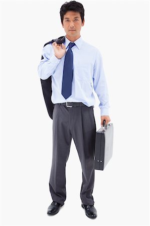 Portrait of a businessman holding a briefcase and his jacket over his shoulder against a white background Stock Photo - Budget Royalty-Free & Subscription, Code: 400-05898285
