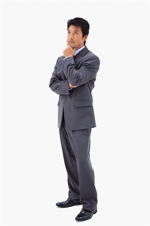 simsearch:400-05687698,k - Portrait of a thoughtful businessman with the arms crossed against a white background Stock Photo - Budget Royalty-Free & Subscription, Code: 400-05898281