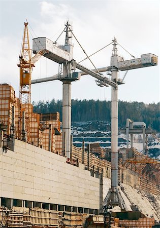 simsearch:400-06075932,k - Works of tower cranes on construction of a dam on the Angara River Fotografie stock - Microstock e Abbonamento, Codice: 400-05898370