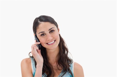 simsearch:400-05717420,k - Woman making a phone call against a white background Foto de stock - Super Valor sin royalties y Suscripción, Código: 400-05898409
