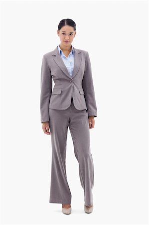 simsearch:400-07246047,k - Portrait of a brunette businesswoman posing against a white background Foto de stock - Super Valor sin royalties y Suscripción, Código: 400-05898571