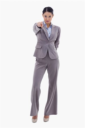 simsearch:693-06668015,k - Portrait of a serious businesswoman pointing at the viewer against a white background Photographie de stock - Aubaine LD & Abonnement, Code: 400-05898581