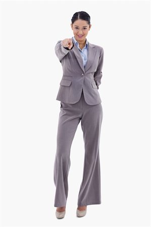 simsearch:400-05895521,k - Portrait of a happy businesswoman pointing at the viewer against a white background Stock Photo - Budget Royalty-Free & Subscription, Code: 400-05898583