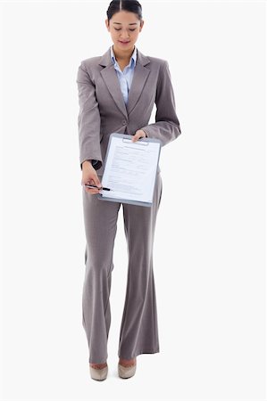 simsearch:400-06633122,k - Portrait of a businesswoman showing a contract against a white background Stock Photo - Budget Royalty-Free & Subscription, Code: 400-05898594