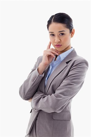 simsearch:400-05729276,k - Portrait of a young businesswoman thinking against a white background Stock Photo - Budget Royalty-Free & Subscription, Code: 400-05898609