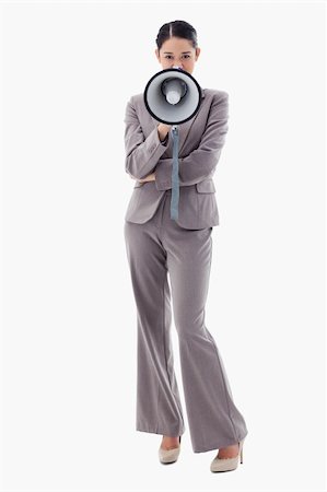 simsearch:400-06763387,k - Portrait of a businesswoman using a megaphone against a white background Stock Photo - Budget Royalty-Free & Subscription, Code: 400-05898600