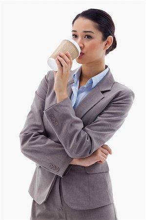 simsearch:400-04188263,k - Portrait of a businesswoman drinking a takeaway tea against a white background Foto de stock - Super Valor sin royalties y Suscripción, Código: 400-05898614