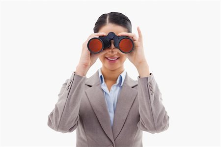 simsearch:400-04632747,k - Businesswoman looking through binoculars against a white background Fotografie stock - Microstock e Abbonamento, Codice: 400-05898631