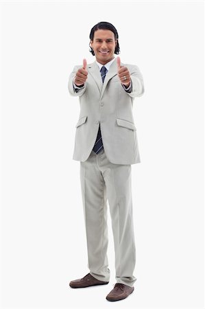 simsearch:400-05898224,k - Portrait of a smiling office worker posing with the thumbs up against a white background Foto de stock - Royalty-Free Super Valor e Assinatura, Número: 400-05898668