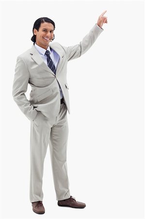 Portrait of a smiling businessman pointing at a copy space against a white background Stock Photo - Budget Royalty-Free & Subscription, Code: 400-05898685