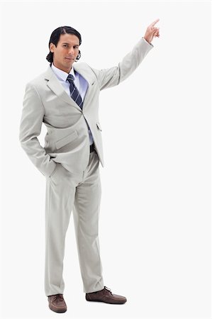 simsearch:400-06091141,k - Portrait of a serious businessman pointing at a copy space against a white background Photographie de stock - Aubaine LD & Abonnement, Code: 400-05898686